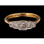 A diamond ring,: set with five rose cut diamonds, stamped 18ct Plat, ring size Q.