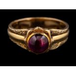 An amethyst ring,: the circular cabochon amethyst in a collet setting,