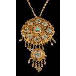A turquoise and seed pearl pendant,: the filigree panel set with cabochon turquoise and seed pearls,