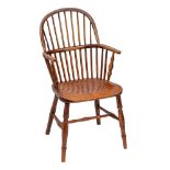 An ash and elm Windsor armchair, first half 19th century,: with arched toprail to the spindle back,