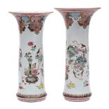 A large graduated pair of Chinese famille rose sleeve vases: finely enamelled with fruit,