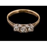A diamond three stone ring,: the three brilliant cut diamonds, estimated to weigh 0.