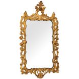 An early 19th Century giltwood cartouche-shaped mirror:,