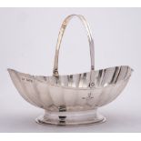 An Edward VII silver swing handled basket, maker Goldsmiths & silversmiths Co Ltd, London,