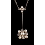 An early 20th century pearl and diamond pendant,: the central 4.