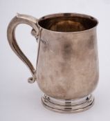 A George V silver mug, maker Adie Bros Ltd, Birmingham, 1935: of cylindrical outline,