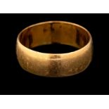 A 22 carat gold ring,: the plain polished band, stamped 22 with full Birmingham hallmarks for 1920,