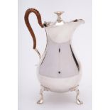 A George V silver hot water jug, maker Mappin & Webb, Sheffield, 1910: of pear-shaped outline,