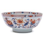 A Chinese Imari bowl: painted with pomegranate, peony,