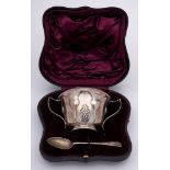 An Edward VII silver christening set, maker S W Smith & Co, London, 1903: of Art Nouveau influence,
