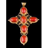 A gold coloured coral cross pendant,