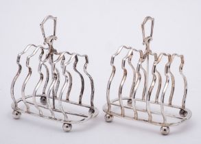 A pair of George V silver four-division toast racks, maker Edward Barnard & Sons Ltd, Birmingham,