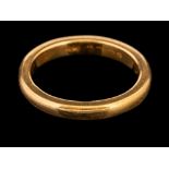 A 22 carat gold ring,: the plain polished band, stamped 22 with full Birmingham hallmarks for 1922,