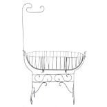 A wrought iron and white painted crib:, of traditional shape,