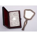 A Continental silver backed miniature hand mirror: 12.