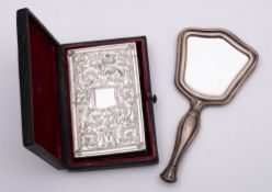 A Continental silver backed miniature hand mirror: 12.