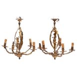 A pair of gilt metal five light chandeliers in Louis XV taste, 20th century,