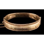 A 1960s 9 carat gold bangle,