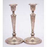 A pair of Elizabeth II silver candlesticks, maker C J Vander Ltd, London,