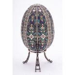 A late 20th century silver gilt and champlevé enamel Easter egg in the Imperial Russian style: