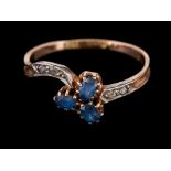 A sapphire and diamond crossover ring,