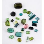 A group of unset tourmalines,: the vari cut and vari coloured tourmalines approximately 40.