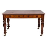 A Victorian oak library table:, the rectangular top with inset leather panel,
