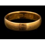 A 22 carat gold ring,: the plain polished band stamped 22 with full Birmingham hallmarks,