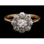 A diamond cluster ring,: the central old brilliant cut diamond, estimated to weigh 0.