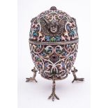 A late 20th century silver gilt and champlevé enamel Easter egg in the Imperial Russian style: