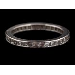 A diamond eternity ring,: set with square cut diamonds, ring size N.