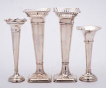A group of four silver specimen vases, various makers and dates: all with weighted bases, 18cm,