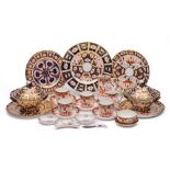 A group of Royal Crown Derby Imari wares: comprising a pair of shaped plates, iron-red marks, pat.