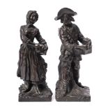 A pair of 19th century French bronze genre figures: of a peasant boy organ grinder and a peasant