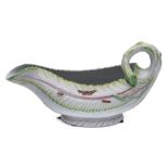 A First Period Worcester polychrome sauceboat: of cos lettuce leaf form with stalk handle,