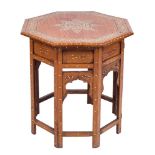 A Near Eastern inlaid octagonal occasional table:, decorated with an ivory marquetry of foliage,