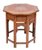 A Near Eastern inlaid octagonal occasional table:, decorated with an ivory marquetry of foliage,