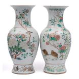 A pair of Chinese famille rose baluster vases: each painted with quail and other birds amongst