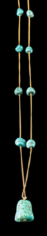 A turquoise matrix bead mounted guard chain with pendant drop,: 48cm long.