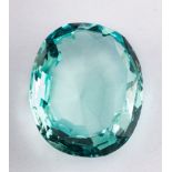 An unset aquamarine,: the oval cut aquamarine, weighing approximately 31.00 carats, 25mm x 21mm x 9.