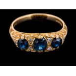 An 18 carat gold sapphire and diamond ring,