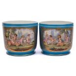 A pair of Sevres-style cachepots: each decorated in the manner of Watteau with cherubs in a