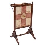 An early 19th Century mahogany firescreen:, with a hinged ledge,