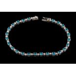 A diamond and treated blue diamond bracelet,