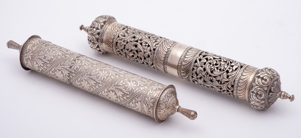 A Persian white metal scroll holder: of traditional cylindrical outline, with pull-off top,