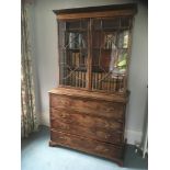 A George III mahogany and inlaid secretaire bookcase:,