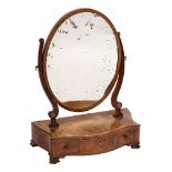 A George III mahogany and inlaid oval swing frame platform toilet mirror:, crossbanded in kingwood,