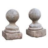 A pair of Dartmoor granite pier finials, 19th century,: modelled as spheres,