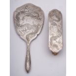 A Chinese silver backed hand mirror, Stamped marks, maker T.