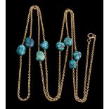 A late 19th/early 20th Century gold and turquoise matrix bead mounted guard chain,